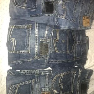 Seven pairs of men’s silver jeans
